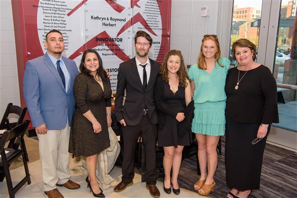 Salvador and Veronica Tafoya, Brooks and Alexa MacBeth, Katie Bostrom and Kathy Bostrom smile to camera.